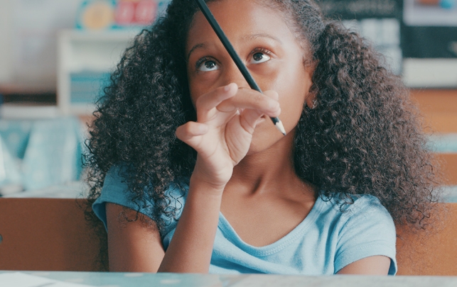 Distracted young girl in classroom